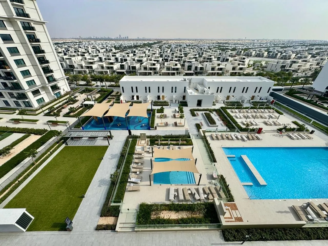 Pool deck of Lime Gardens and the villa streets of Dubai Hills Estate